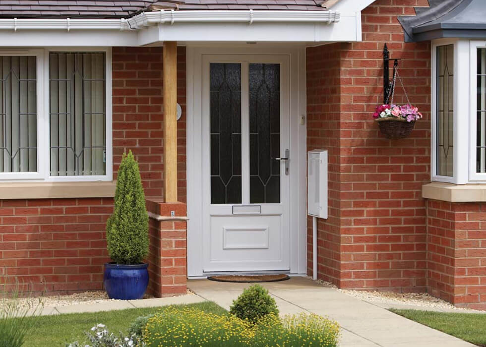 https://www.stedek.co.uk/wp-content/uploads/2018/04/uPVC-entrance-door-with-silver-hardware.jpg